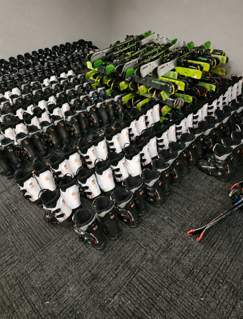 Rows of ski boots and skis available at Midwest Ski Depot